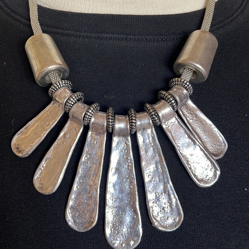 Silver alloy spoon necklace.